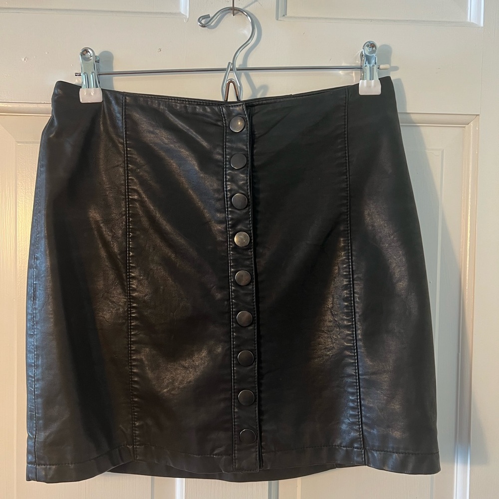 Free People black faux leather mini skirt with snap buttons